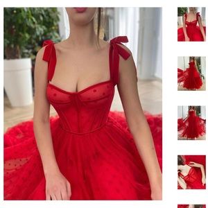 Teuta Matoshi red dress